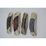 Four recent vintage Herbertz folding lock knives, three with wood handles and engraved 3.5"