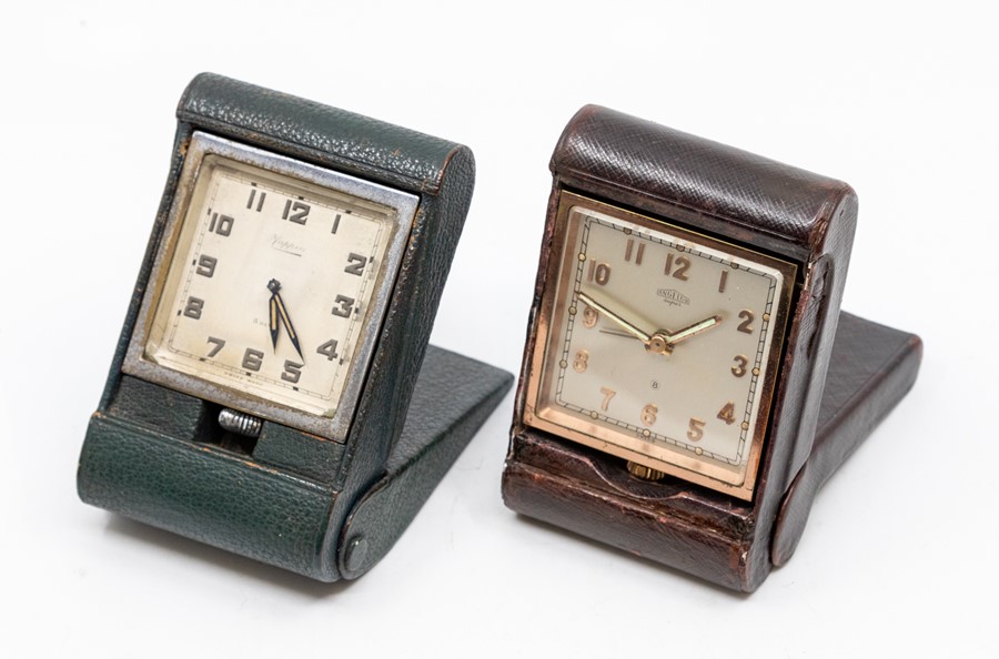 Two leather-cased travel clocks, the first retailed by Mappin, the Swiss eight day movement in a