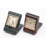 Two leather-cased travel clocks, the first retailed by Mappin, the Swiss eight day movement in a