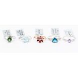 A collection of five 9ct gold rings to include, white gold and apatite, rose gold, red spinel and