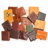 Twenty various recent and vintage gentleman's leather wallets in tan and brown tones. (20)