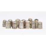 A collection of assorted silver and white metal thimbles, mainly early 20th Century, by various