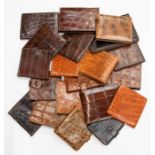 Twenty various recent and vintage gentleman's crocodile wallets in tan and brown tones. (20)
