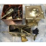 A collection of 19th Century and early 20th Century brass wares including meat trivet and fire irons
