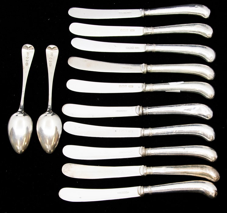 A set of five Edwardian pistol handled butter knives with silver blades, by James Dixon & Sons,