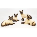 Four Beswick Siamese cats