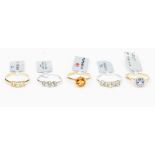 A collection of 9ct gold rings to include three yellow gold rings set with Madeira citrine,