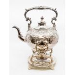 A Victorian plated kettle and associated stand and burner, the ornate kettle chased with floral