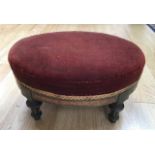 A small Victorian foot stool, ebonised, with gilt, original seat in red velvet