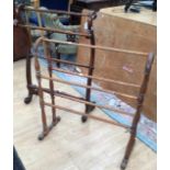 Two early 20th Century towel rails, mahogany and pine examples, mahogany one measuring 40cm high,