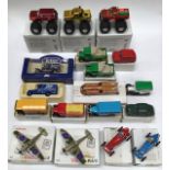 Die cast vehicles including three Majorette monster trucks all boxed with unused stickers.
