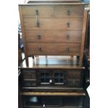 An early 20th Century oak chest of drawers, fitted with two short over three long graduated drawers,