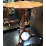 A 19th Century mahogany tilt top tripod table, a further mahogany tripod table with fixed top and