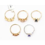 A collection of 9ct gold rings to include a rose gold, morganite and diamond three stone ring, an