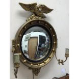 Reproduction Regency wall mirror, round with eagle design, fish eye glass, electric ready