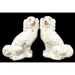 A pair of Staffordshire Victorian spaniel figures, hand painted