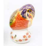 A Royal Crown Derby Kingfisher paperweight with gold stopper.