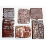 Six various Edwardian silver mounted crocodile gentleman's wallets. (6) Condition: varying degrees