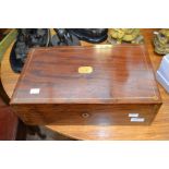 A mahogany Victorian writing box with brass banding and key
