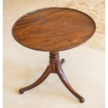 A 19th Century mahogany tilt-top occasional table, the circular top with moulded edge above a