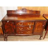 An early 20th Century mahogany sideboard, in the Georgian style, back rail to top, fitted with two