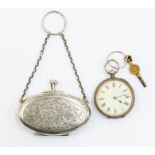 A George V silver oval purse with engraved foliate decoration, cartouche initialled E.C, length