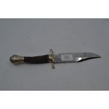 A vintage Bowie type fixed blade knife, the stag horn grip with plated embossed pommel and brass