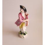 A Samson Figure of a Musician holding a Bag Pipe. Date: circa 1890 Size: 5cm diameter, 20cm high