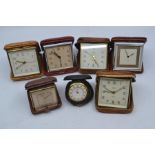 Seven various Smiths travel clocks, including leather and crocodile cased examples, 7.5-9cm. (7)