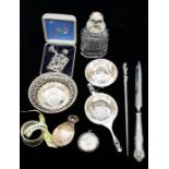 A collection of silver to include: Georgian style shell shaped caddy spoon, by FH, Sheffield,