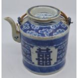 A Chinese blue and white teapot and cover, 19th Century, of cylindrical form and decorated with shou