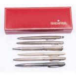 A silver ballpoint pen and retracting pencil set, Birmingham 1993, with engine-turned finish,