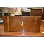 A late Victorian travel writing box, in mahogany, with brass banding, no key present