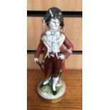 A 19th Century porcelain figure of a Gentleman, wearing a bicorn hat