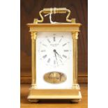 An Anstey and Wilson eight day brass cased carriage clock, with carrying handle