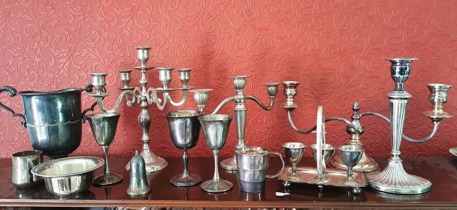 Quantity of plated table to include: candelabrum, jugs etc makers include Mappin and Webb, Falstaff,