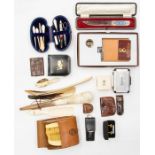 A group of vintage and recent vintage gentleman's accessories, including a leather lined hip