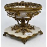 A French gilt metal, glass and white marble table centrepiece, the oval bowl raised on a foliate