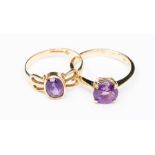 An amethyst and 9ct gold ring, size 0½, along with another set with oval amethyst rubover set open