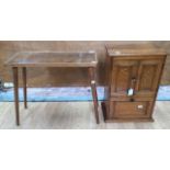 An early 20th Century small oak cupboard, together with a teak table (2)