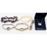 A collection of jewellery including a single strand freshwater pearl necklace, a silver bracelet,