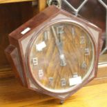 An Art Deco bakelite wall clock, hexangonal form, circa 1940s