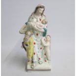 A Stafford Figure of Charity standing on a square base Date: circa 1825 Size: 7x7cm diameter, 19cm