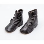 A pair of black leather baby boys boots ankle strap with four buttons, 1900/1901