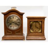 A German oak bracket clock, early 20th Century, with arched top and plinth base, the silvered 5.5"