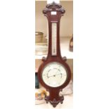 A mid 19th Century mahogany banjo barometer and thermometer, scrolled top and bottom