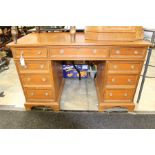 A Victorian pitch pine twin pedestal writing desk, the plain top above three frieze drawers,