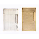 Two St.Dupont Paris cigarette lighters, 3rd quarter 20th Century, one yellow metal, the other silver