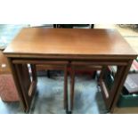 A G-Plan type teak revolving top nest of three tables (3)