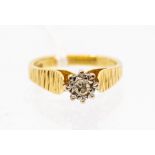 A diamond and 18ct gold solitaire ring, the illusion set diamond weighing approx. 0.7ct, to raised